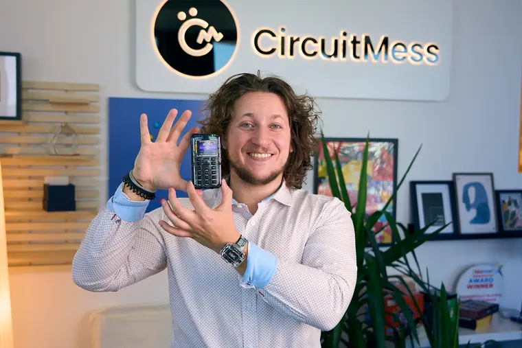 Presenting MAKERphone 2.0 beneath the CircuitMess logo in the Zagreb office