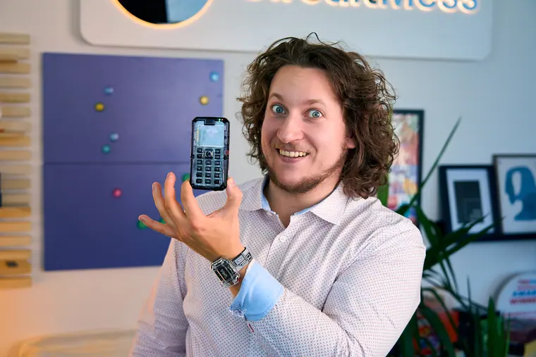 MAKERphone 2.0 balanced on an open palm